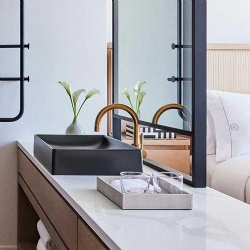 Bathroom vanities with Calaccata quartz counter top in Omni hotel