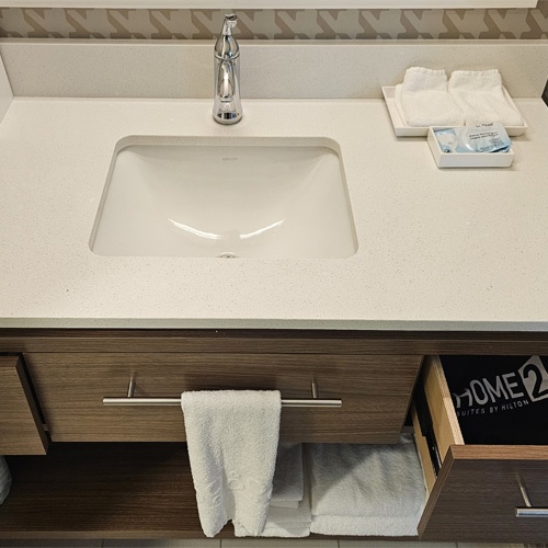 Bath Vanity Cabinet and Quartz Countertop in Home2 Suites
