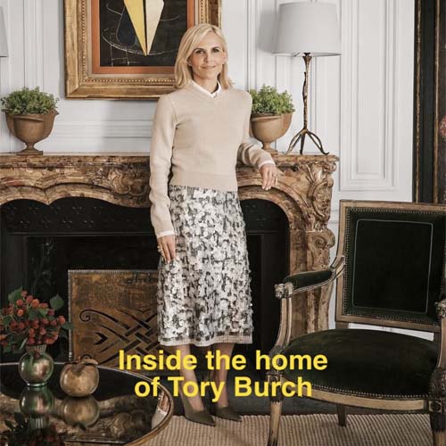 Tory Burch in her new Parisian home with elegant marble fireplace