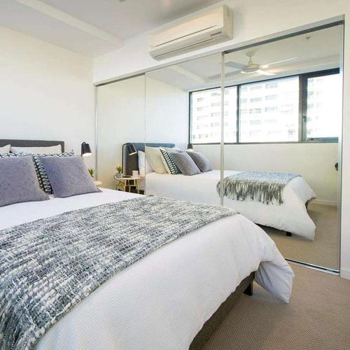 Telescopic and synchronized sliding glass and mirror door