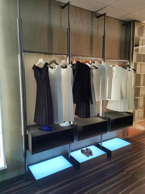 poliform closet with aluminum clothing hanging rod