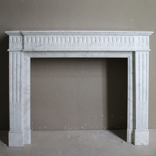 A French style Louis XVI marble fireplace mantel