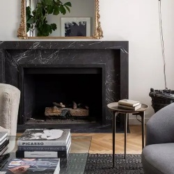 A chic space with a black marble fireplace