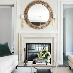 A double-sided limestone fireplace surround