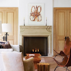 An impressive custom limestone fireplace