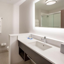 Bath Vanities with Plastic Laminate Vanity Apron and Storage Cubby in Holiday Inn Express