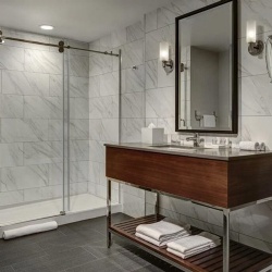 Bathroom vanity and shower in Le Meridien hotel by Marriott