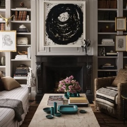 Black granite marble fireplace surround and modern artwork