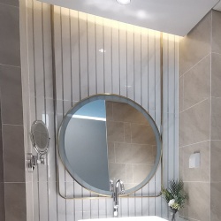 Ceiling mounted metal framed vanity mirror with LED lighting
