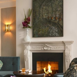 Classic marble fireplace mantel and modern wall artwork Dylan Hotel Dublin