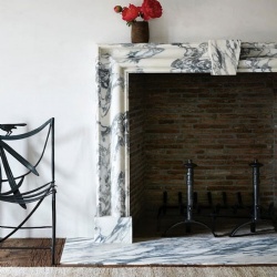 Dramatic Abrabescato marble simple fireplace surround