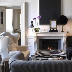 Elegant hotel living room design with marble fireplace