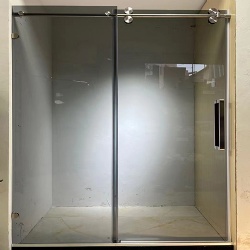 Frameless heavy glass shower door for hotel bathroom