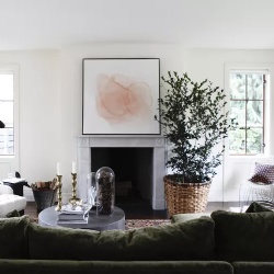 Historic marble fireplace mantel with classic artwork