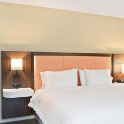 Hotel headboard with wall sconce
