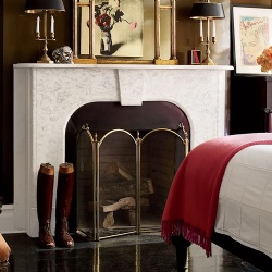 Marble fireplace mantel in the bedroom