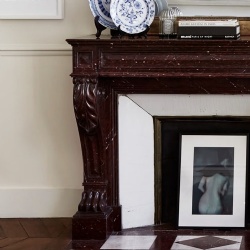 Red marble fireplace mantel