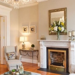 Reproduction fireplace mantel with irish corbel by Bianco Carrara marble