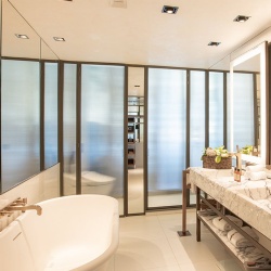 Ribbed glass moving wall in bathroom