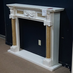 White fireplace with yellow fluted column