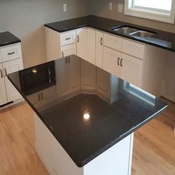 black granite with white cabinets