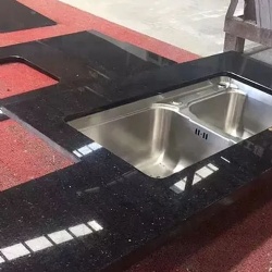 granite black galaxy kitchen countertop with stainless steel sink
